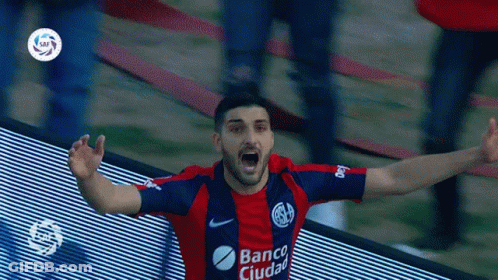 A Man Wearing A Banco Ciudad Jersey Celebrates A Goal GIF