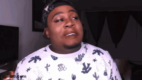 A Man Wearing A Bandana And A Cactus Shirt GIF