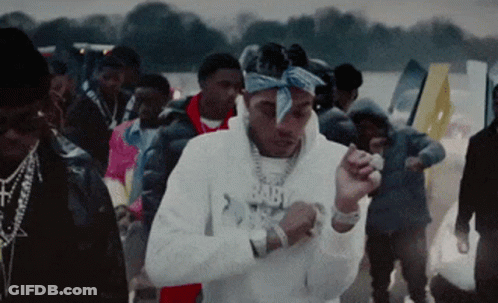 A Man Wearing A Bandana And A Hoodie That Says Baby On It GIF
