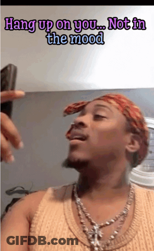 A Man Wearing A Bandana And A Necklace Says " Hang Up On You ... Not In The Mood " GIF