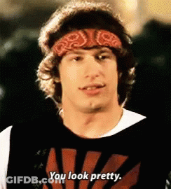 A Man Wearing A Bandana And A Shirt That Says You Look Pretty . GIF