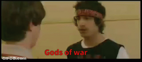 A Man Wearing A Bandana Is Talking To Another Man In A Movie . GIF