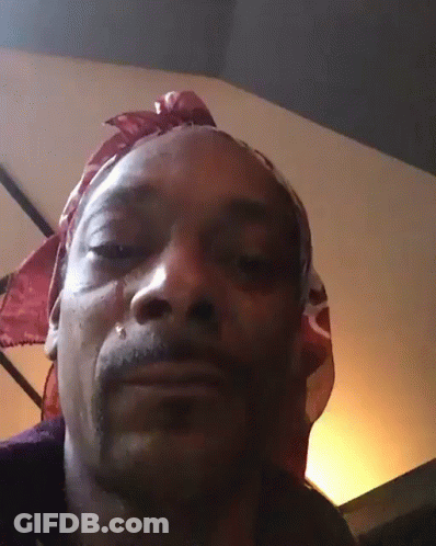 A Man Wearing A Bandana On His Head Is Crying GIF
