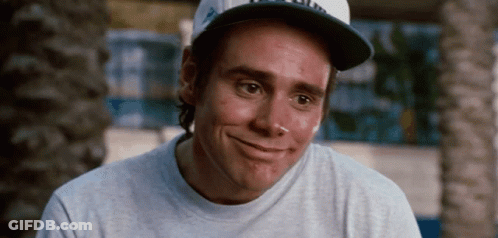 A Man Wearing A Baseball Cap And A Gray Shirt Smiles GIF