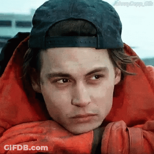 A Man Wearing A Baseball Cap And A Red Jacket GIF