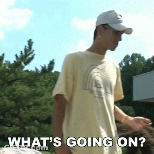 A Man Wearing A Baseball Cap And A T-Shirt Says What 'S Going On GIF