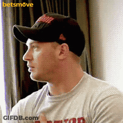 A Man Wearing A Baseball Cap And A T-Shirt With A Betsmove Logo GIF