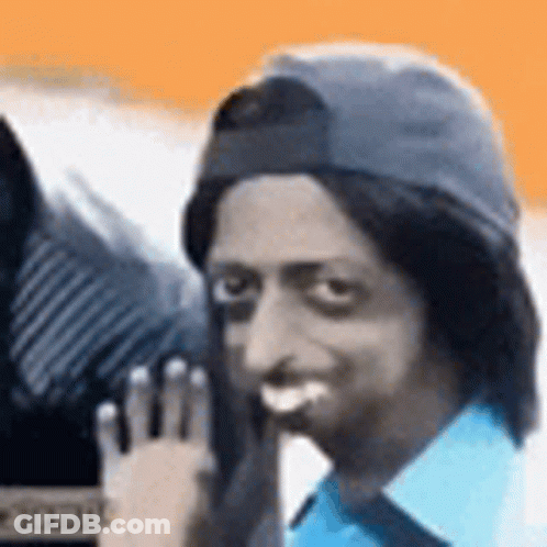 Man In Baseball Cap Waving And Smiling GIF