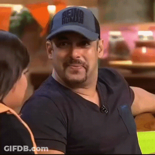 A Man Wearing A Baseball Cap That Says Being Human GIF
