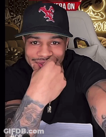 A Man Wearing A Baseball Cap With A Red Star On It GIF