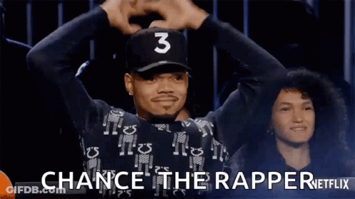 A Man Wearing A Baseball Cap With The Number 3 On It Is Holding His Hands In The Air . GIF