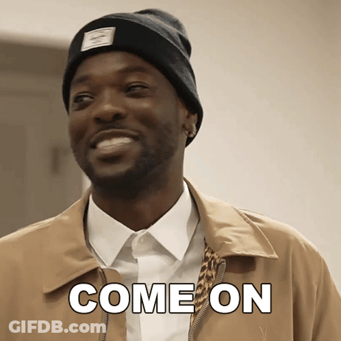 A Man Wearing A Beanie And A Jacket Is Smiling And Says Come On GIF