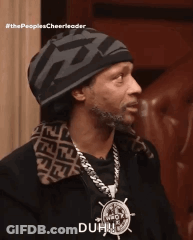 A Man Wearing A Beanie And A Necklace Says Duh GIF