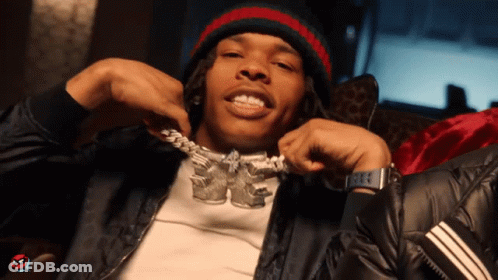 A Man Wearing A Beanie And A Necklace That Says ' Kc ' On It GIF