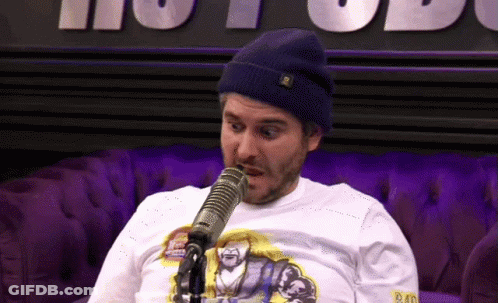 A Man Wearing A Beanie And A Shirt That Says Bad On It GIF