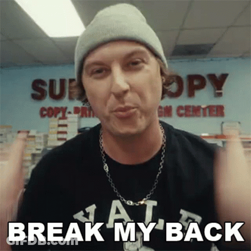 A Man Wearing A Beanie And A T-Shirt With The Words Break My Back On It GIF