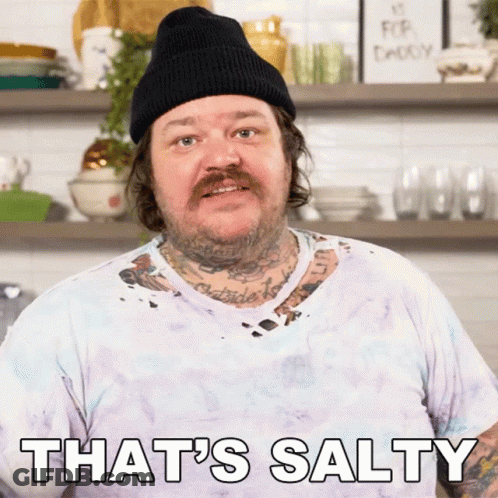 A Man Wearing A Beanie And A White Shirt Says That 'S Salty GIF