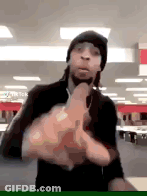 A Man Wearing A Beanie And Sunglasses Is Giving The Middle Finger GIF
