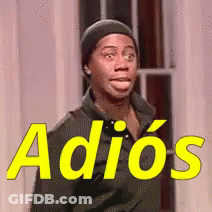 A Man Wearing A Beanie Is Standing In Front Of A Sign That Says Adiós GIF