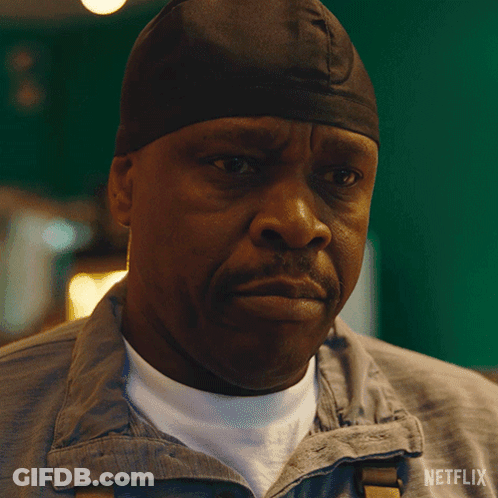 A Man Wearing A Beanie Says Please In A Netflix Advertisement GIF