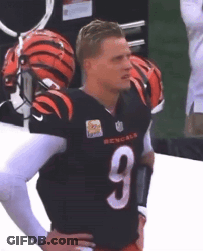 A Man Wearing A Bengals Jersey With The Number 9 GIF