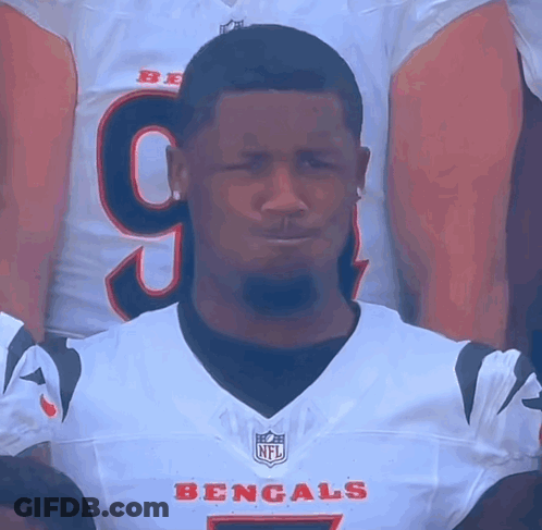 A Man Wearing A Bengals Jersey With The Number 9 On The Front GIF