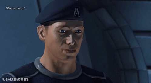 A Man Wearing A Beret With The Letter A On It Looks At The Camera GIF