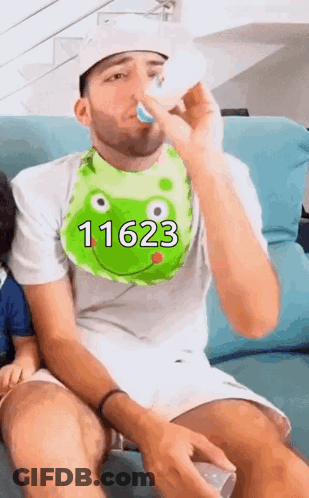 A Man Wearing A Bib That Says 11623 On It GIF