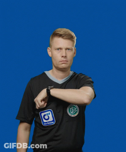 A Man Wearing A Black Adidas Shirt Holds Up A Yellow Card GIF