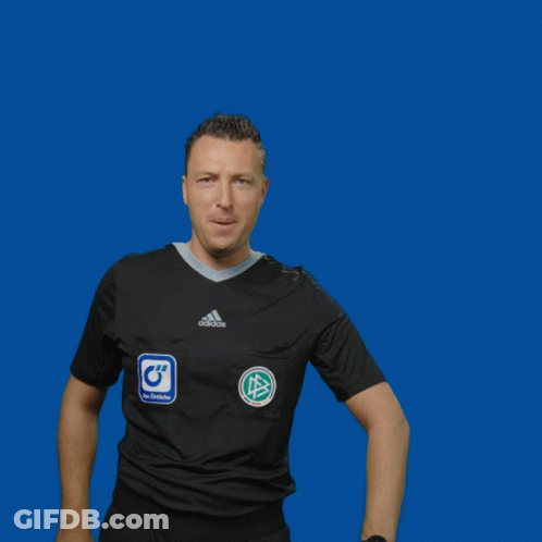 A Man Wearing A Black Adidas Shirt Holds Up A Yellow Card GIF