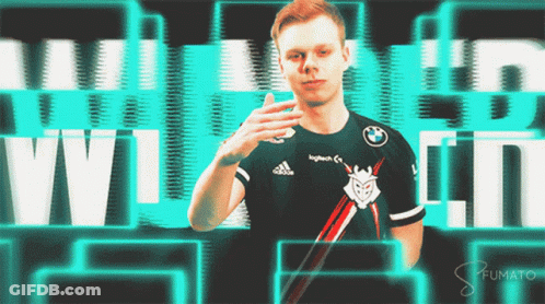 A Man Wearing A Black Adidas Shirt Is Standing In Front Of A Green Background GIF