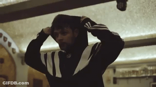 A Man Wearing A Black And White Adidas Sweatshirt GIF