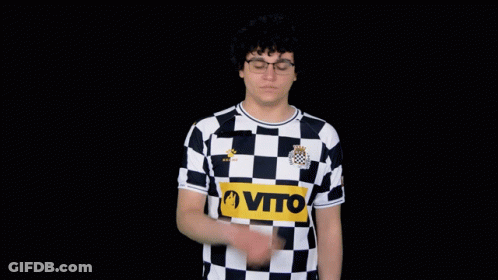 A Man Wearing A Black And White Checkered Shirt That Says Vito GIF