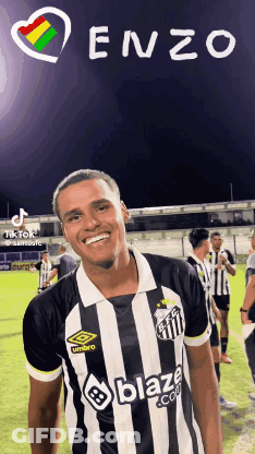 A Man Wearing A Black And White Striped Shirt That Says Blaze GIF