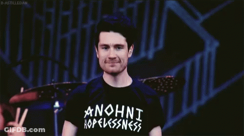 A Man Wearing A Black Anohni Hopelessness Shirt GIF