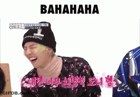 A Man Wearing A Black Beanie And A Floral Shirt Is Laughing With The Word Bahahaha Written Above Him GIF