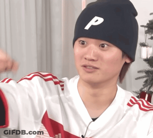 A Man Wearing A Black Beanie With The Letter P On It GIF