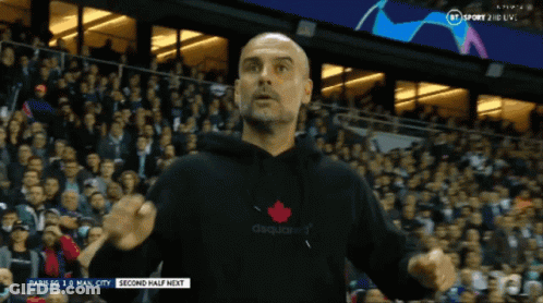 A Man Wearing A Black Dsquared2 Sweatshirt Stands In Front Of A Crowd GIF
