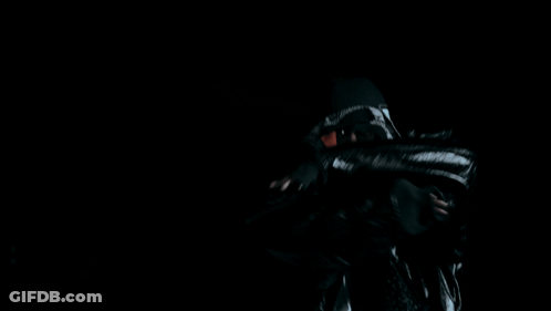 A Man Wearing A Black Hat And A Black Jacket GIF