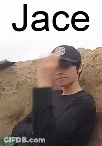 A Man Wearing A Black Hat And A Black Shirt Is Making A Funny Face . GIF