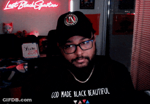 A Man Wearing A Black Hat And A Black Shirt That Says God Made Black Beautiful GIF