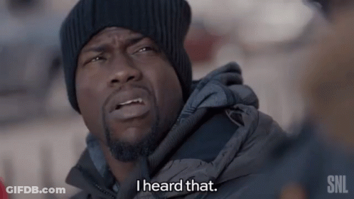 A Man Wearing A Black Hat And A Grey Jacket Says I Heard That GIF