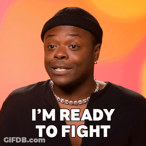 A Man Wearing A Black Hat And A Necklace Says I 'M Ready To Fight GIF