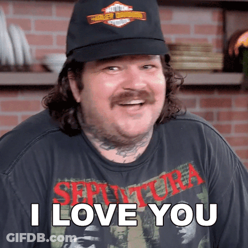 A Man Wearing A Black Hat And A Shirt That Says I Love You GIF