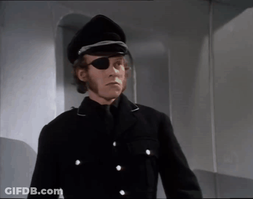 A Man Wearing A Black Hat And Eye Patch GIF