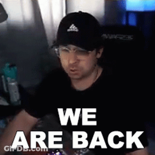 A Man Wearing A Black Hat And Glasses Says We Are Back GIF