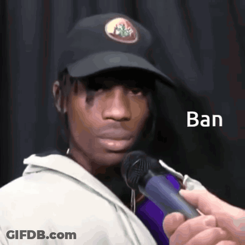 A Man Wearing A Black Hat Is Being Interviewed By Someone Holding A Microphone With The Word Ban Written On It GIF