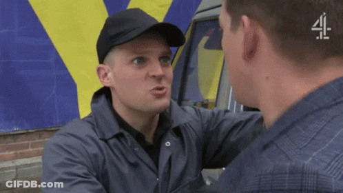 A Man Wearing A Black Hat Is Talking To Another Man In Front Of A Van That Says 4 GIF