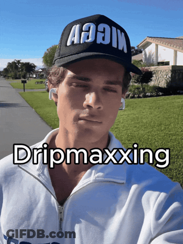 A Man Wearing A Black Hat That Says Aooin On It GIF