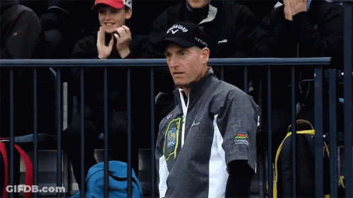 A Man Wearing A Black Hat That Says Callaway Is Smiling GIF